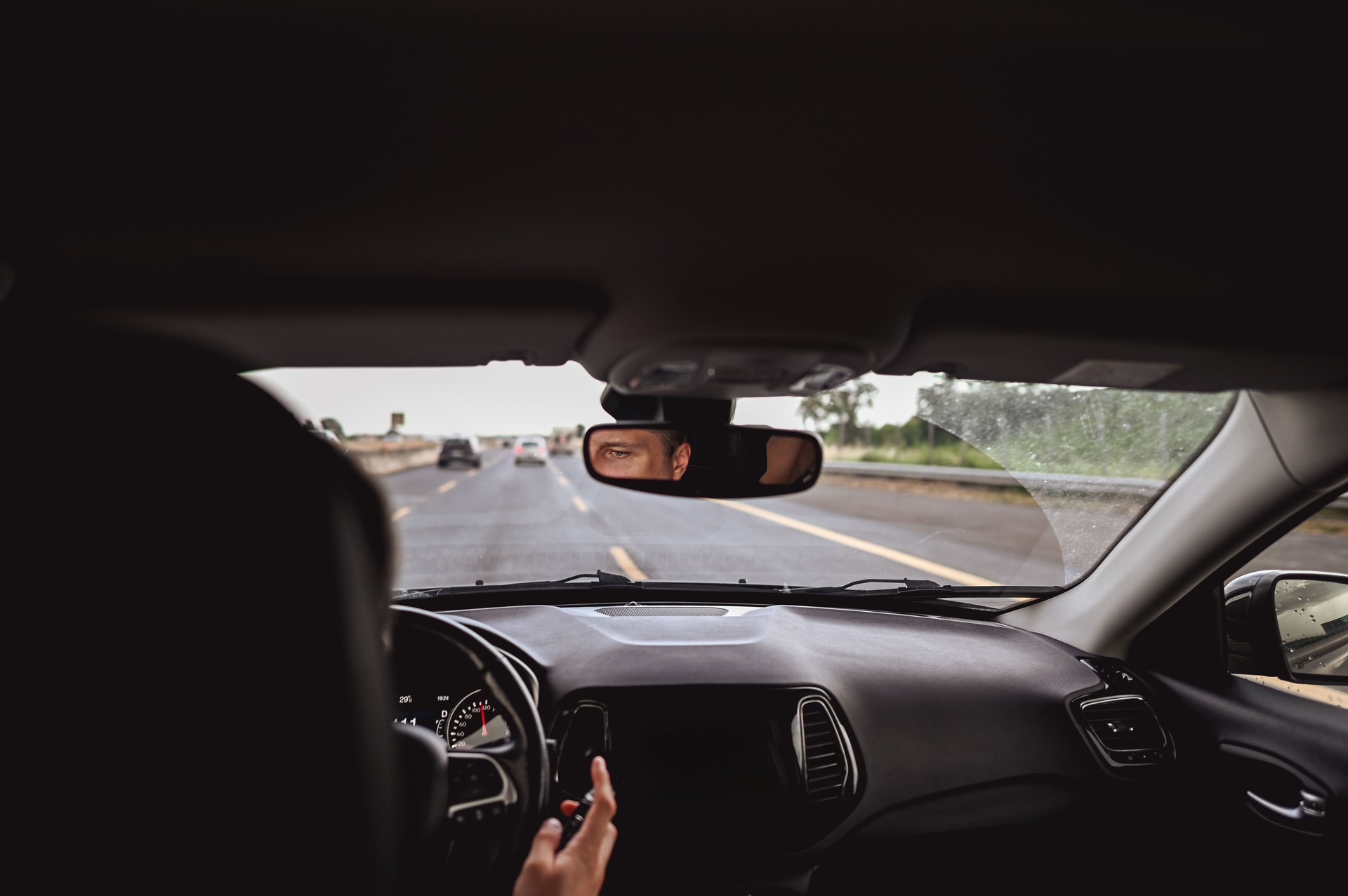 Man driving car.